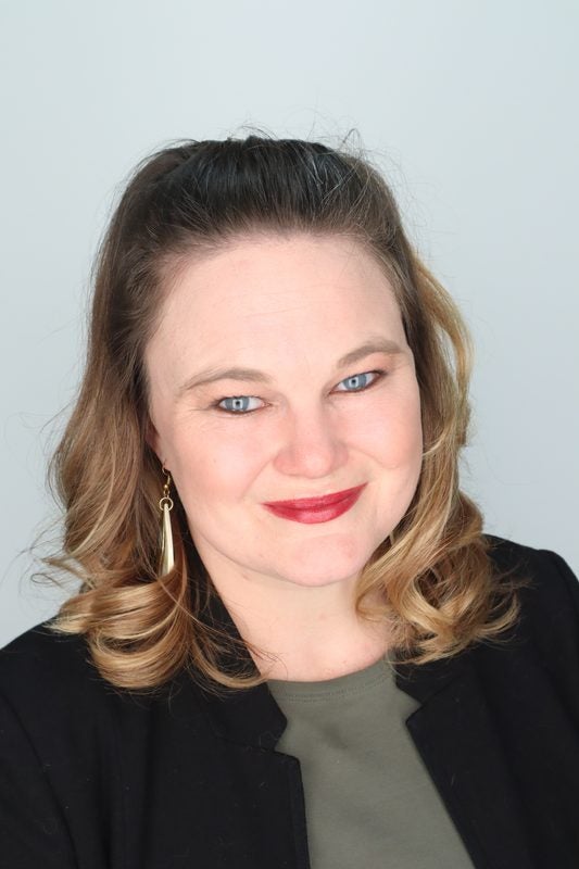 A headshot of Alexa Hight with brown hair against a light background.